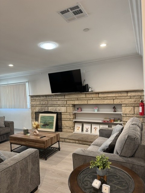 The bright living room with stone fireplace at HavenBloom