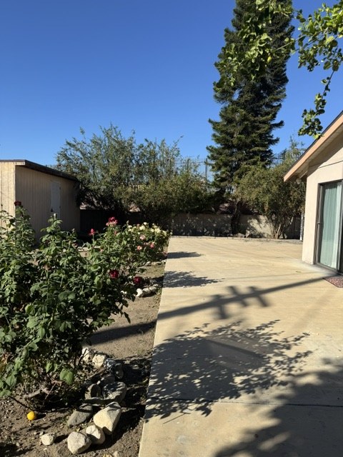 The side yard patio with roses at HavenBloom